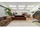 Expansive living area with couches, hanging chair, palm tree and dining table at 5521 Sw 31St St, Ocala, FL 34474