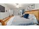 Spacious main bedroom with plush king bed, ceiling fan, and ample natural light at 5521 Sw 31St St, Ocala, FL 34474