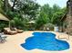 Inviting backyard pool area featuring lounge chairs, dining set, and a well-maintained pool at 5521 Sw 31St St, Ocala, FL 34474