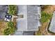 An aerial view showcases the complex's roof, landscaping, parking, and outdoor seating area at 559 Fairway Circle # A, Ocala, FL 34472