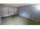 Bedroom with plush green carpet and ample closet space, ready for personalization at 559 Fairway Circle # A, Ocala, FL 34472