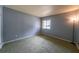 Comfortable bedroom with soft carpet and a bright window at 559 Fairway Circle # A, Ocala, FL 34472