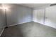 Bedroom with a floor lamp next to ample closet space at 559 Fairway Circle # A, Ocala, FL 34472