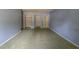 Bedroom featuring green carpeting, ample closet space, and freshly painted blue walls at 559 Fairway Circle # A, Ocala, FL 34472