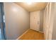 Entryway featuring wood flooring, closet space, and a secure front door for added security at 559 Fairway Circle # A, Ocala, FL 34472