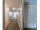 Hallway with carpeting leading to a bright, open room at 559 Fairway Circle # A, Ocala, FL 34472