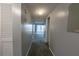 Hallway with carpet leading to a bright room at 559 Fairway Circle # A, Ocala, FL 34472