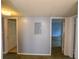 Hallway with access to bedrooms, featuring utility panel at 559 Fairway Circle # A, Ocala, FL 34472