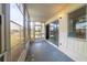An enclosed lanai with a view of the street and adjacent properties at 559 Fairway Circle # A, Ocala, FL 34472