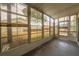Screened lanai provides natural light and a view of a lush, landscaped yard at 559 Fairway Circle # A, Ocala, FL 34472