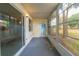 Covered and screened lanai with painted concrete floor and view of the yard at 559 Fairway Circle # A, Ocala, FL 34472