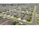 An aerial view displays this homesite with manicured lawns and proximity to neighborhing homes at 5862 Sw 80Th Ln, Ocala, FL 34476
