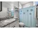Bathroom features granite counters, vanity, and shower with curtain at 5862 Sw 80Th Ln, Ocala, FL 34476