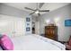 This bright bedroom boasts ample closet space, ceiling fan, and well-lit vanity at 5862 Sw 80Th Ln, Ocala, FL 34476