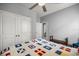 The bedroom has a ceiling fan and a closet, creating a cozy and well-organized space at 5862 Sw 80Th Ln, Ocala, FL 34476