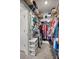 Organized walk-in closet featuring ample shelving, hanging space, and convenient storage solutions at 5862 Sw 80Th Ln, Ocala, FL 34476