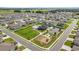 Aerial view of neighborhood amenities including a sparkling pool, playground and green space at 5862 Sw 80Th Ln, Ocala, FL 34476