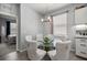 Charming dining area with glass table, upholstered chairs, and natural light at 5862 Sw 80Th Ln, Ocala, FL 34476