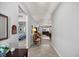 Inviting hallway with neutral walls and tile flooring that leads to the living areas and bedrooms at 5862 Sw 80Th Ln, Ocala, FL 34476