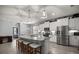 Bright kitchen features a spacious island, stainless appliances, and pendant lighting at 5862 Sw 80Th Ln, Ocala, FL 34476