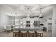 Bright kitchen features a spacious island, stainless appliances, and pendant lighting at 5862 Sw 80Th Ln, Ocala, FL 34476