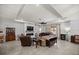 Inviting living room with a modern fireplace and sliding glass doors to the outdoor patio at 5862 Sw 80Th Ln, Ocala, FL 34476