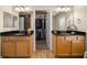 Bathroom featuring double sinks, granite countertops, and walk-in closet at 6436 Sw 44Th Ct, Ocala, FL 34474