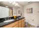 Bright bathroom features double sinks, granite counters, and decorative wall art at 6436 Sw 44Th Ct, Ocala, FL 34474