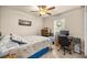 Bedroom with desk, ceiling fan, and a view of the window at 6436 Sw 44Th Ct, Ocala, FL 34474