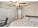 Bedroom featuring a ceiling fan, closet and study area at 6436 Sw 44Th Ct, Ocala, FL 34474