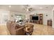 Open living room flows to lanai, features tile floors and vaulted ceilings at 6436 Sw 44Th Ct, Ocala, FL 34474