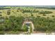 Stunning aerial view of new construction home on a large lot surrounded by lush greenery at 7483 Sw 121St Ter, Dunnellon, FL 34432