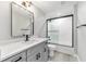 Stylishly renovated bathroom with modern vanity, quartz countertops, sleek fixtures, and a tiled shower-tub combo at 7483 Sw 121St Ter, Dunnellon, FL 34432