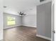 Bright bedroom with a modern ceiling fan and wood-look floors at 7483 Sw 121St Ter, Dunnellon, FL 34432