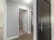 Hallway with a barn door, updated floors, and neutral paint colors, creating a modern and inviting space at 7483 Sw 121St Ter, Dunnellon, FL 34432