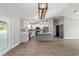 Open floor plan featuring kitchen with gray island and stainless steel appliances at 7483 Sw 121St Ter, Dunnellon, FL 34432