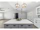 Large kitchen island with seating, pendant lighting, and an open view of the living space at 7483 Sw 121St Ter, Dunnellon, FL 34432