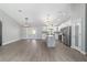 Spacious open floor plan with gray kitchen island and stainless steel appliances at 7483 Sw 121St Ter, Dunnellon, FL 34432