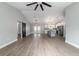 Open-concept living space featuring high ceilings, wood-look floors, and modern finishes throughout at 7483 Sw 121St Ter, Dunnellon, FL 34432