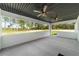 View of covered patio with dual ceiling fans and lots of space at 7483 Sw 121St Ter, Dunnellon, FL 34432