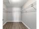 Walk-in closet with wood look floors and wire shelving at 7483 Sw 121St Ter, Dunnellon, FL 34432