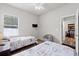 Bright bedroom featuring two beds, a window, and hardwood flooring at 808 Overlook Grove Dr, Winter Haven, FL 33884
