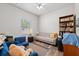 Comfortable bedroom with a sofa, a bookshelf and a ceiling fan at 808 Overlook Grove Dr, Winter Haven, FL 33884