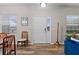 Welcoming entryway with a white front door, coat rack, wood-look flooring, and natural light from two windows at 808 Overlook Grove Dr, Winter Haven, FL 33884