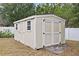 Outdoor storage shed with a double door, windows, and a ramped entry at 808 Overlook Grove Dr, Winter Haven, FL 33884