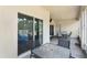Covered patio with neutral decor offering a comfortable outdoor seating area at 808 Overlook Grove Dr, Winter Haven, FL 33884