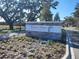 Stone community sign for Twisted Oaks Reserve with manicured landscaping at 8582 Pinecrest Trl, Wildwood, FL 34785