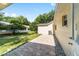 Lovely backyard features brick patio, green grass, and mature trees at 8712 Sw 92Nd St # C, Ocala, FL 34481