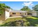 View of back yard with brick patio from a distance at 8712 Sw 92Nd St # C, Ocala, FL 34481