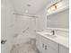 Well-lit bathroom with marble flooring, bath tub and shower combo, and modern vanity at 8712 Sw 92Nd St # C, Ocala, FL 34481